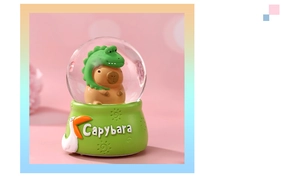 Close-up of a capybara in dinosaur hoodie inside a glowing crystal ball night light