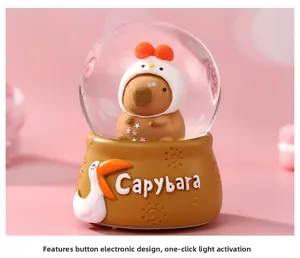 Detail of Capybara crystal ball night light with pink bow doll and button cell base