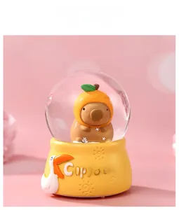Detailed view of Capybara glowing crystal ball night light with a yellow base