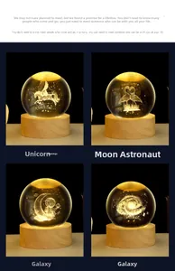 Detail view of 3D laser-engraved crystal ball night lights with wooden base