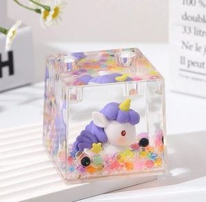 Transparent acrylic liquid unicorn pen holder detail, colorful floating beads and cute ornament.