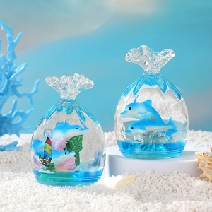 Ocean-themed liquid sandglass toy in a dolphin lucky bag shape with blue base