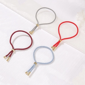 Handmade adjustable red string bracelet set with golden beads and elastic braided design