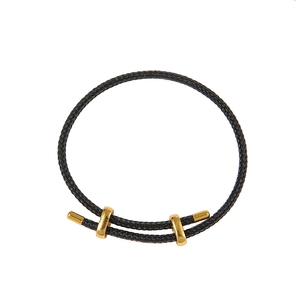 Adjustable black woven rope bracelet with polished gold metal rings and accents