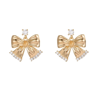 Elegant gold bow earrings with white zircon accents and hanging tassel charms