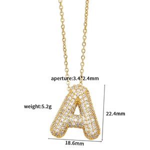 Detailed macro view showing letter A pendant dimensions with cubic zirconia inlay