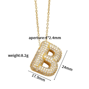Detailed view of gold letter B pendant with cubic zirconia inlay and measurements