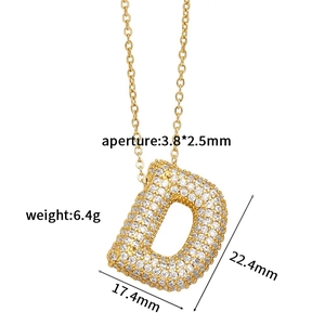 Detailed view of gold letter D pendant with cubic zirconia and exact measurements