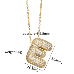 Detailed view of gold zircon letter E pendant with dimensions 21.8mm and 16.5mm