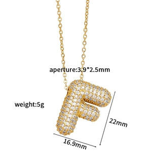 Detailed view of gold letter F pendant with zircon stones and precise size dimensions