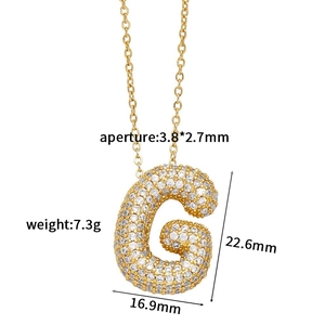 Macro view of gold bubble letter G pendant with detailed size and weight measurements
