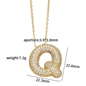 Detailed macro view of letter Q pendant with dimensions and shimmering zircon inlay