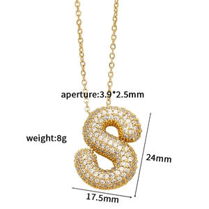 Detail of gold letter S pendant with cubic zirconia inlay and product measurements