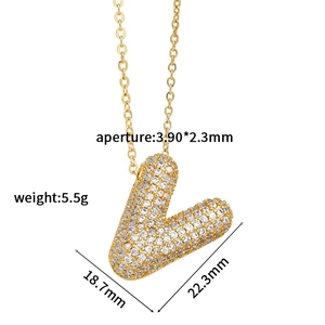 Macro view of gold V letter pendant with pavé zircons and detailed dimensions