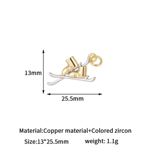 Detail view of copper zircon ski pendant showing 13x25.5mm size and weight specs
