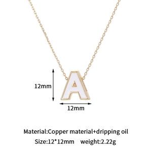 Detail view of 12mm 14K gold plated letter A charm with white oil drip and measurements