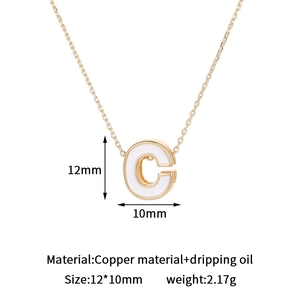 Detailed view of 14K gold plated letter C pendant with white dripping oil and dimensions