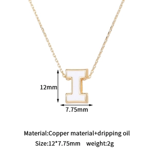 Detailed size view of gold-plated letter I pendant with white dripping oil enamel