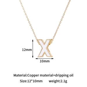 Macro shot of 14K gold-plated letter X pendant with dimensions 12x10mm for DIY jewelry