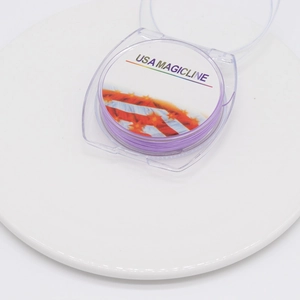 Detail of purple elastic crystal bead cord in transparent round plastic spool packaging