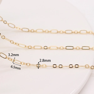 Macro detail of gold O-chain links with precise 3.2mm width and 6.5mm length dimensions