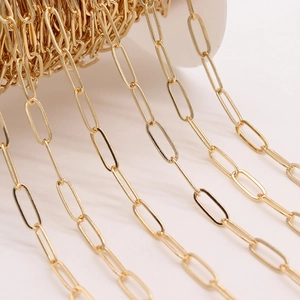 14K gold plated oval paperclip chain on a white spool for DIY jewelry making