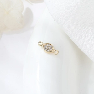 Macro detail of gold-plated geometric connector with pave zircon for DIY jewelry making