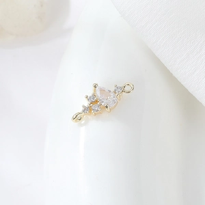 Macro view of gold-plated pendant connector with teardrop zircon for DIY jewelry making