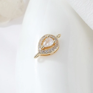 Detail of gold-plated pear-shaped connector with micro-pave cubic zirconia for DIY jewelry