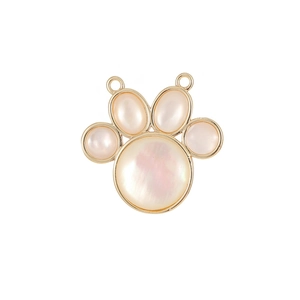 Handmade white mother-of-pearl cat paw charm with gold trim and double hanging rings