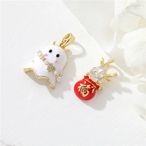 Detail of 14k gold plated ghost pearl and red lucky pouch charms with sparkling zircon