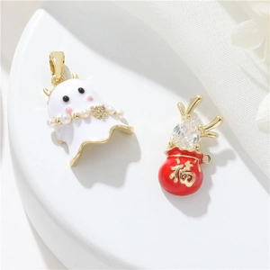 Detail of ghost charm with pearls and red lucky bag pendant in 14k gold plated finish