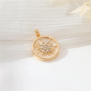 Close-up of 14K gold plated sun pendant with micro-set zircon and star pattern detail