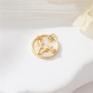 Macro shot of 14k gold deer antler pendant with white shell base and crystal