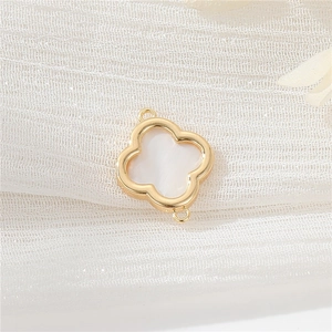 Detail of 14k gold-filled clover pendant with white mother of pearl inlay for DIY jewelry