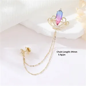 Elegant gold crown brooch with gradient crystal and twin hanging chains for suits