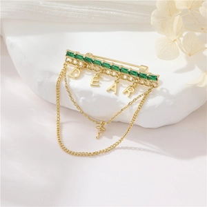 Elegant gold emerald bar brooch with DEAR fringe and ballerina charm for dresses