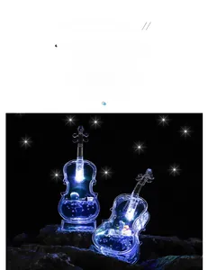 Luminous violin shaped oil drop hourglass with blue liquid and starry glitters