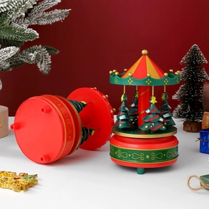 Christmas carousel music box with mini Christmas trees and festive red and gold details