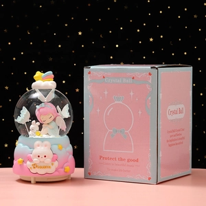 Whimsical glowing crystal ball music box with girl and bunny in dream cloud base