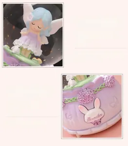 Détail d'une fée de dessin animé et d'un lapin blanc dans une boule de cristal lumineuse