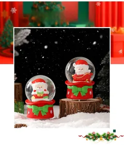 Detail of Christmas snow globe with Santa in a red sleigh on a festive snow-covered background