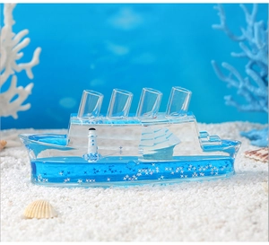 Macro shot of cruise ship fluid bottle on a beach scene with shells and white sand