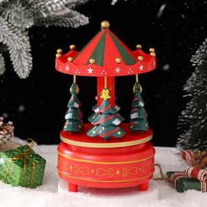 Christmas carousel music box in red and green with mini trees and snowflake patterns