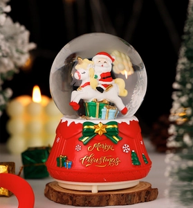 Detail of Santa Claus on unicorn inside glowing crystal ball with Merry Christmas base