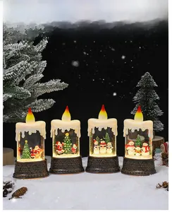 Macro detail of Christmas snow globe candles with Santa and snowman miniature scenes