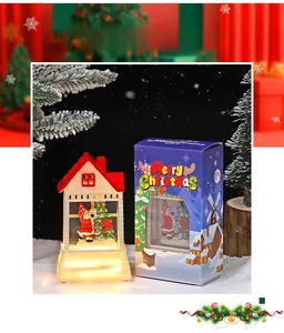 Close-up of a glowing Christmas house lantern with Santa Claus and festive gift box