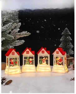 Four Christmas house lanterns with LED warm light featuring Santa and snowman patterns