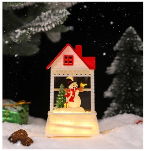 Close-up of a festive Christmas lantern with a snowman and warm glowing LED lighting