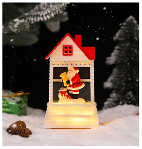 Close-up of a white Christmas lantern featuring a Santa Claus figurine with warm LED glow